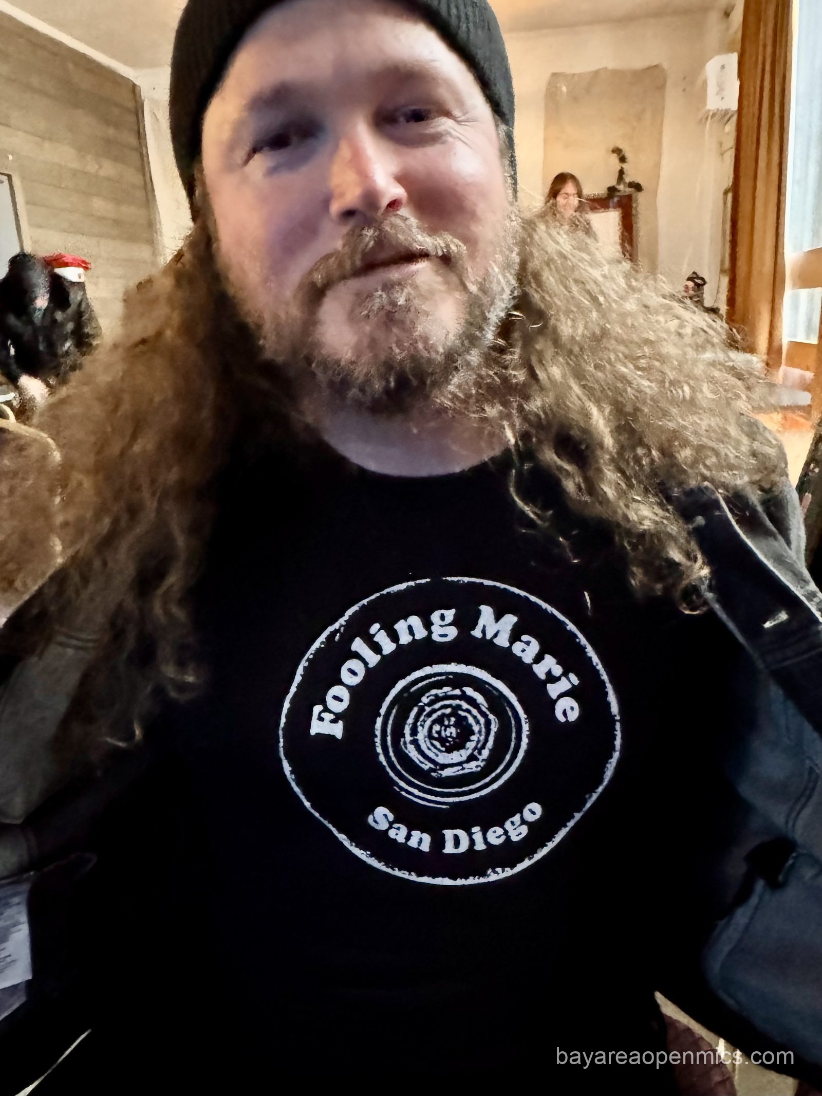 Jesse Reeves displays his band's t-shirt at The Up The Creek Records open mic