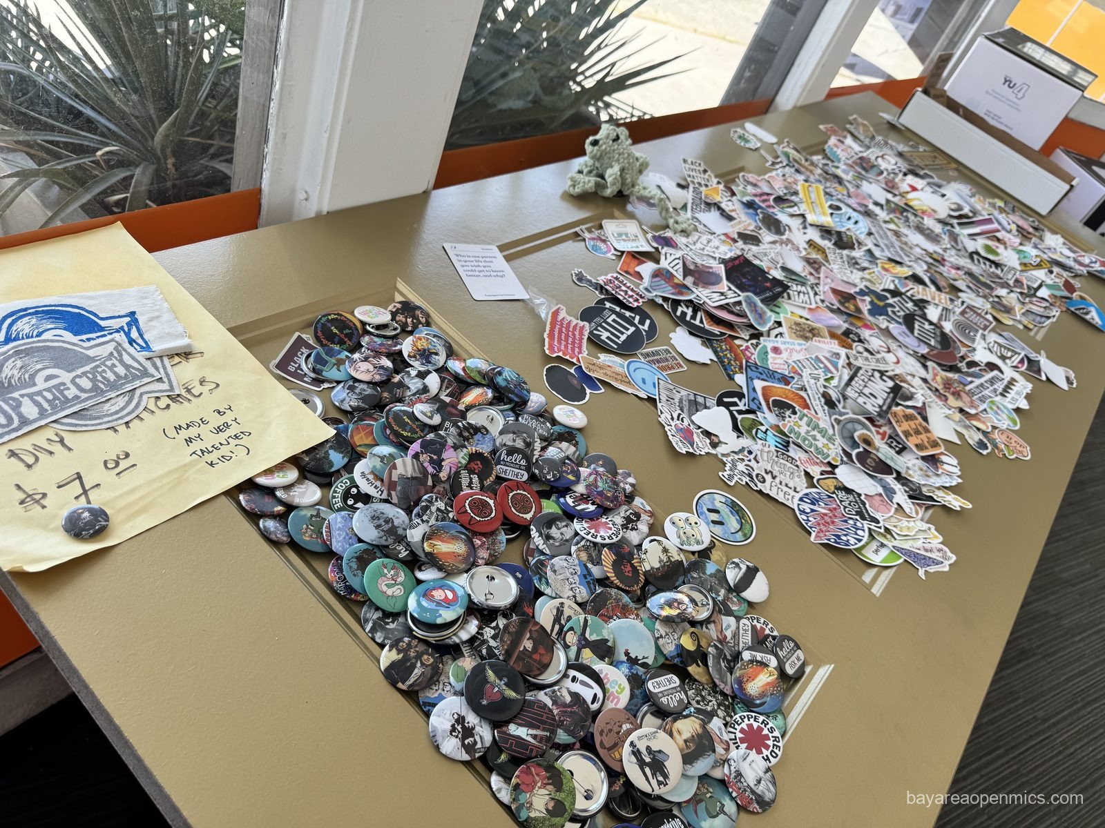 The buttons and stickers at Up The Creek Records