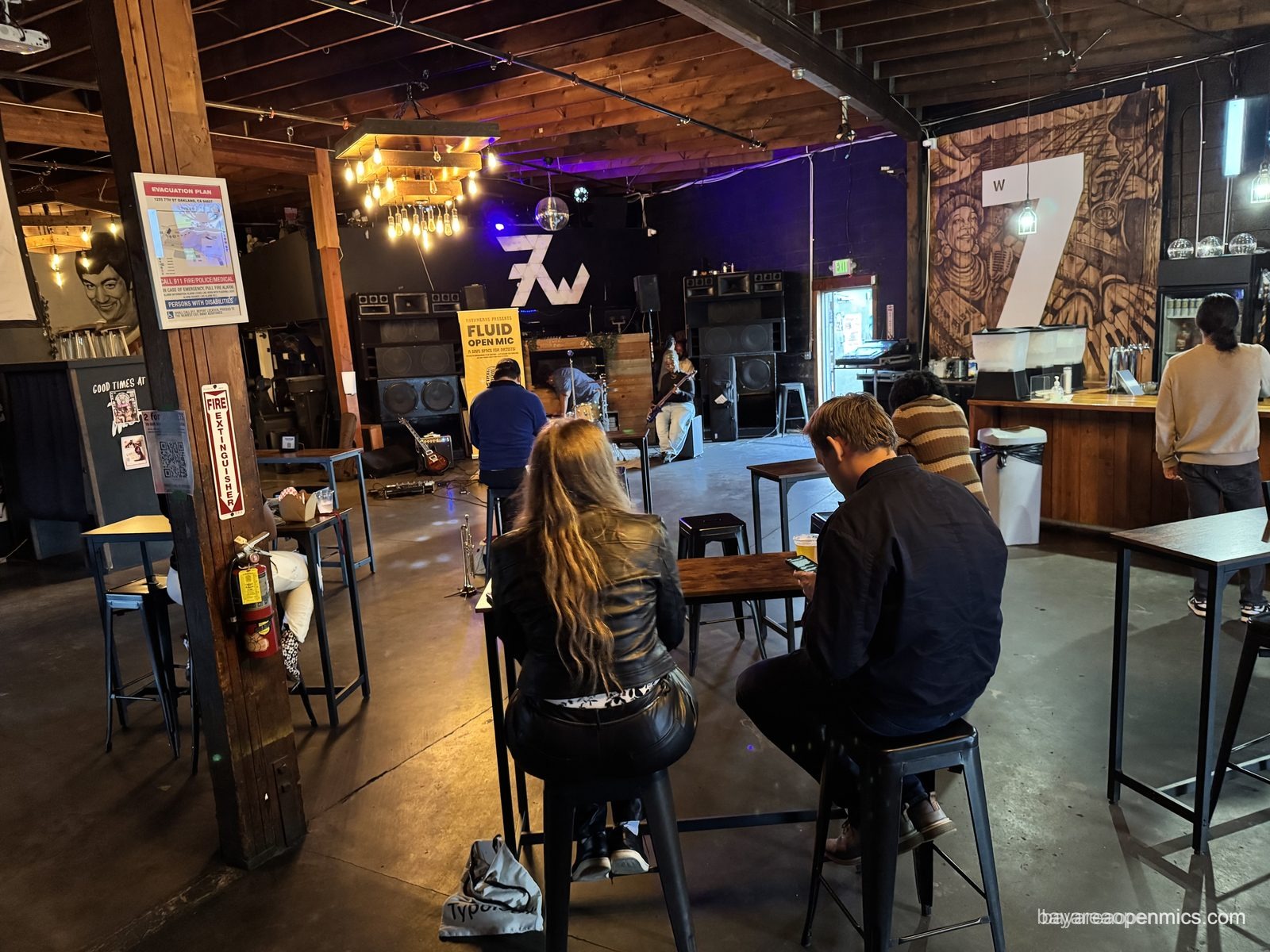 The crowd gathering before the Fluid open mic begins at 7th West