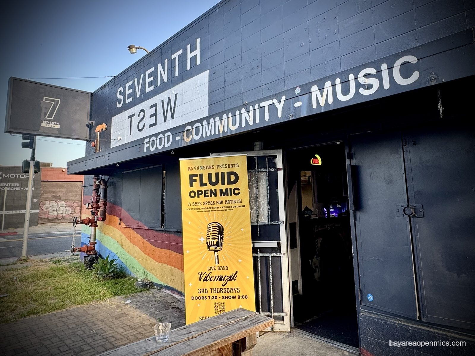 The Fluid open mic signage at the entrance to 7th West in West Oakland