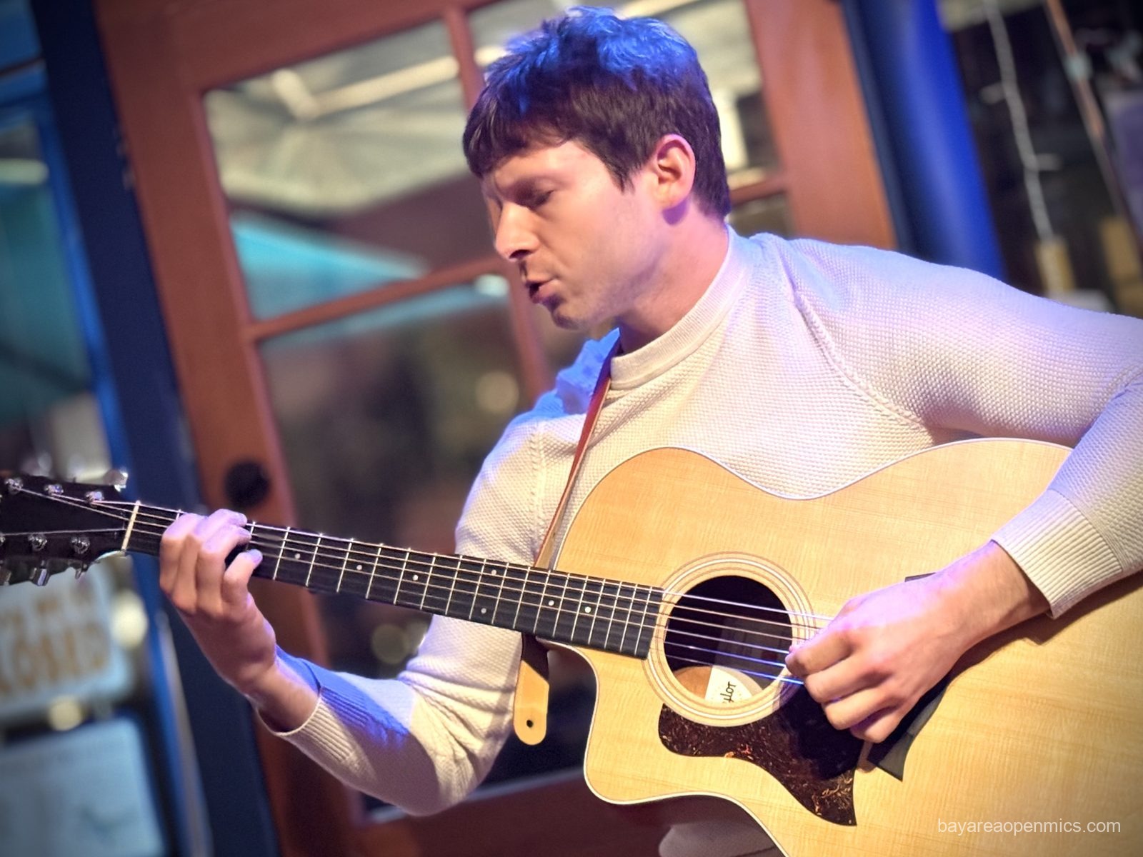 Max performs at The Bazaar Cafe open mic in San Francisco