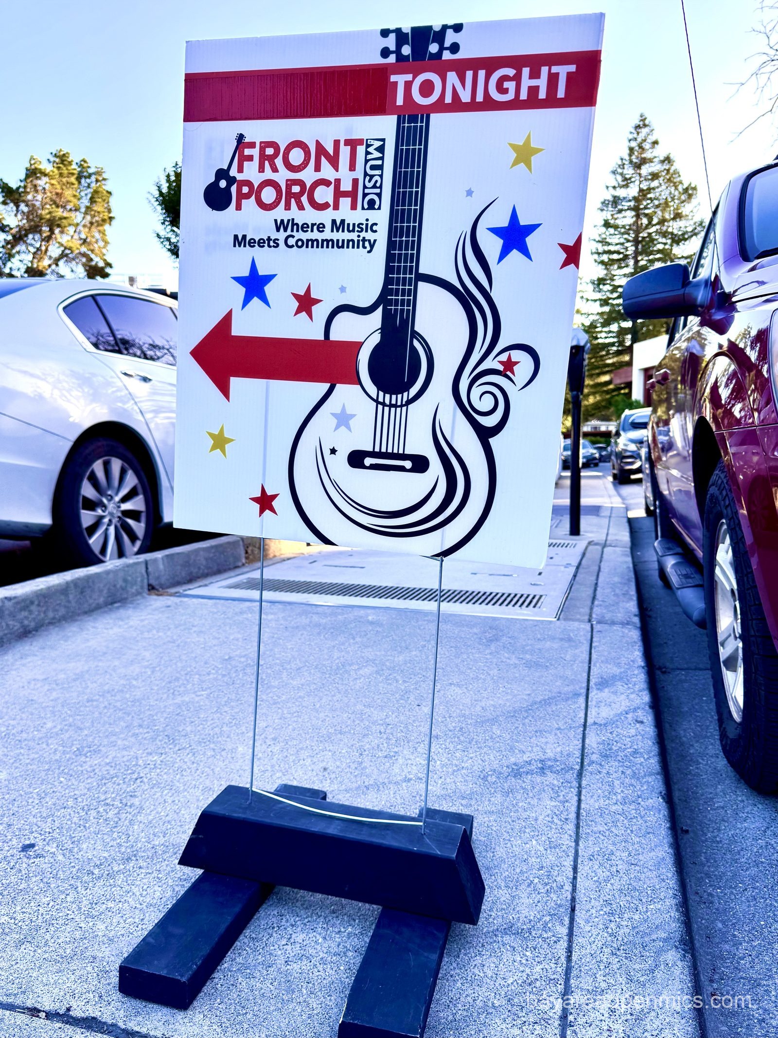 A road sign for the Front Porch Music open mic at Lamorinda Music in Lafayette