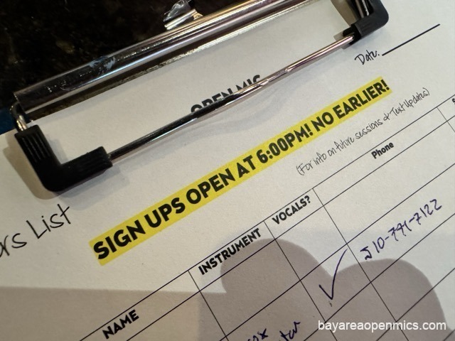 The open mic sign-up sheet on a clipboard at the end of the bar at Pinot's Palette in Livermore
