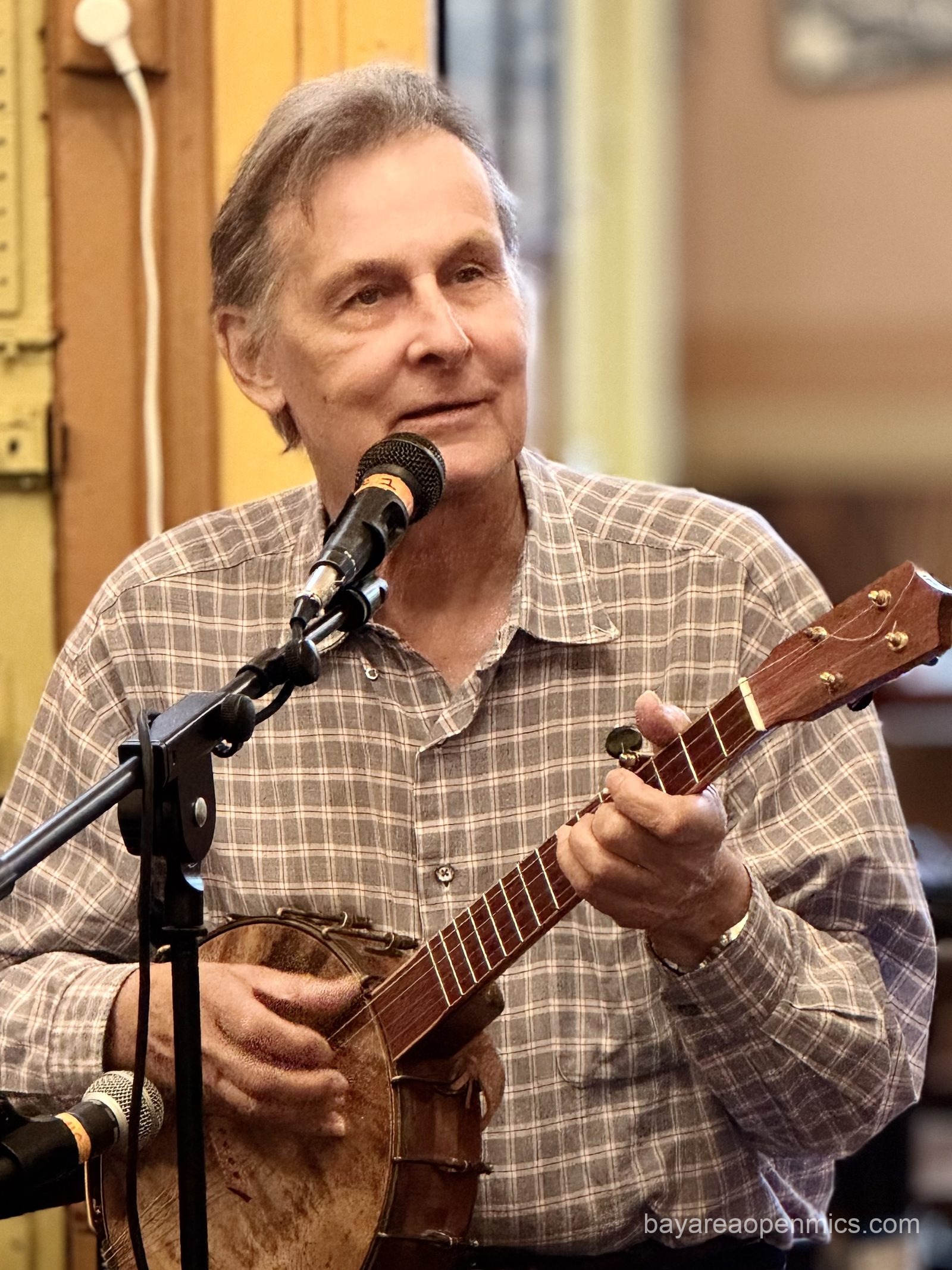 Dennis plays five-string banjo at Simple Pleasures Open Mic in San Francisco