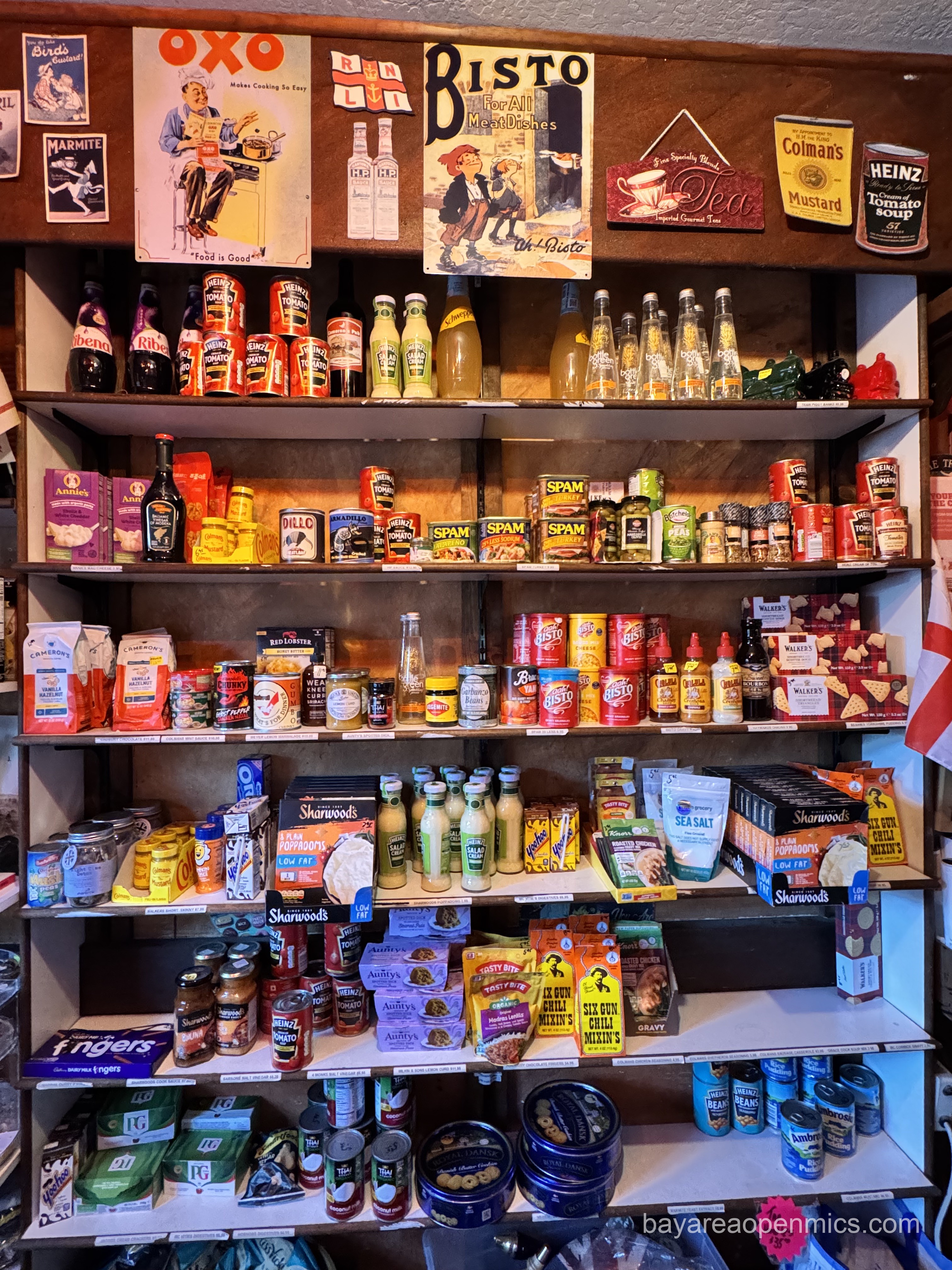 lollipops and suckers are cluttered together with other brightly-colored candies on a shelf