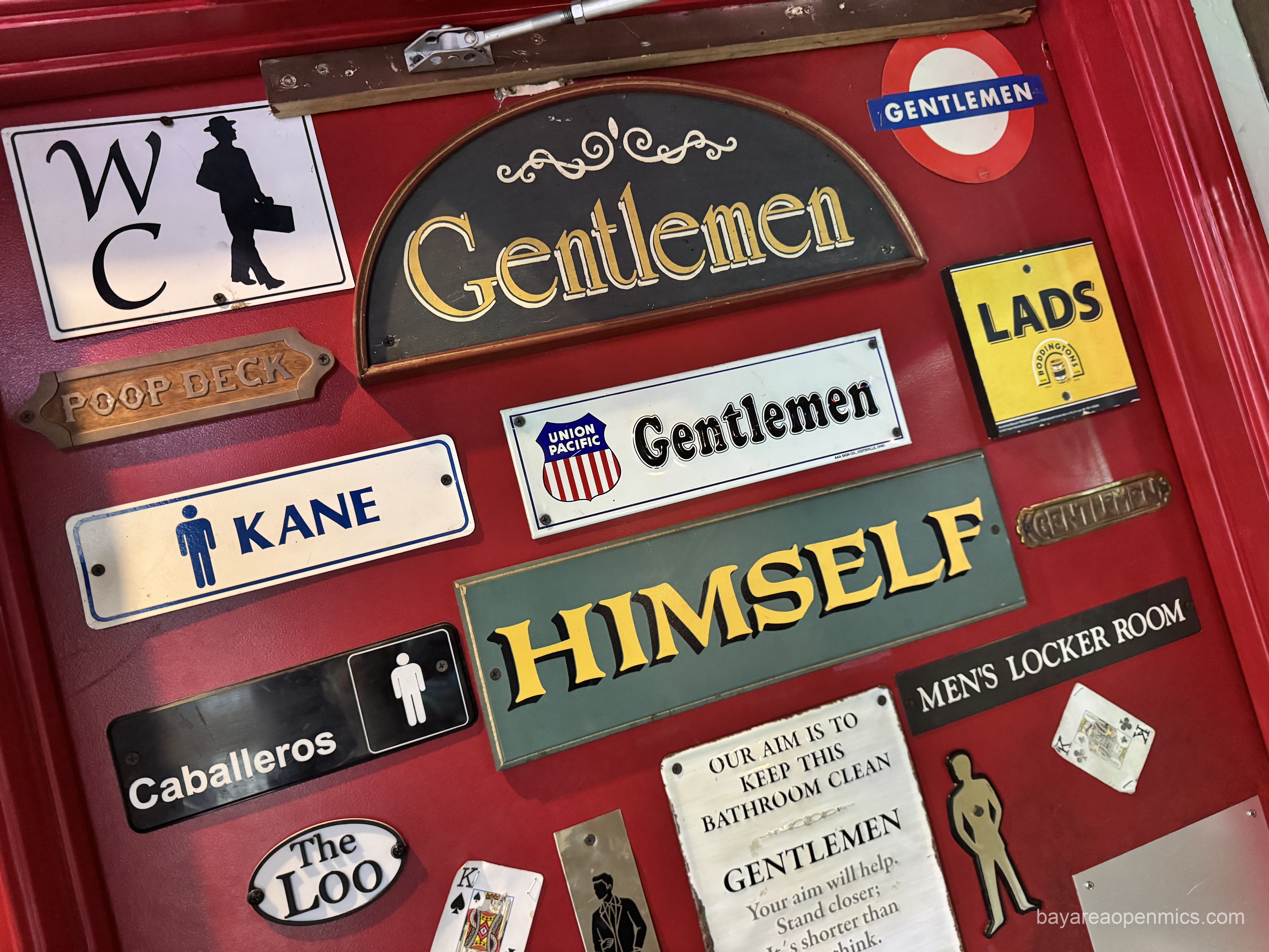 many signs on the men's room door