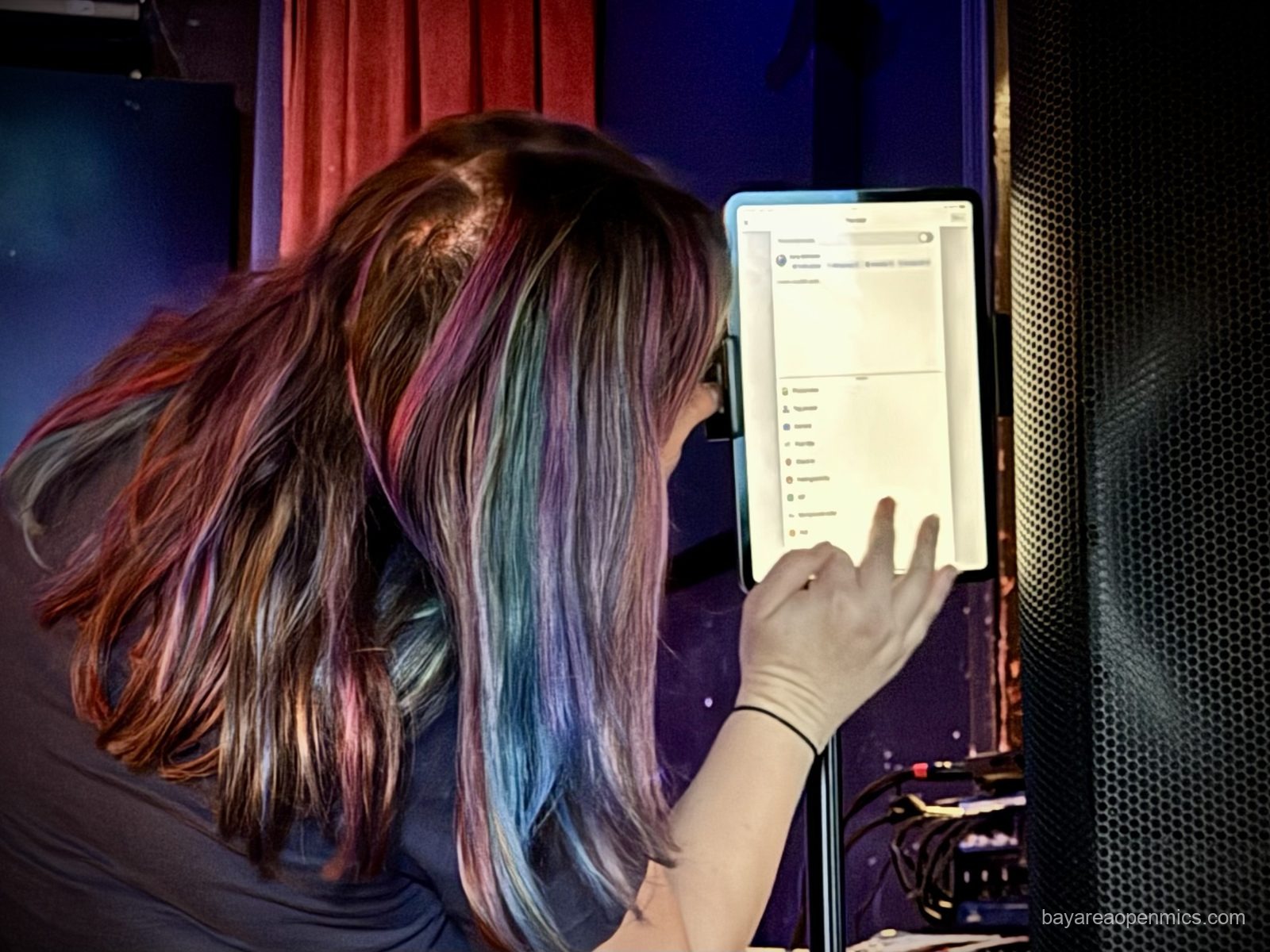 Carly Beltramo logs into the streaming setup at the Hotel Utah open mic