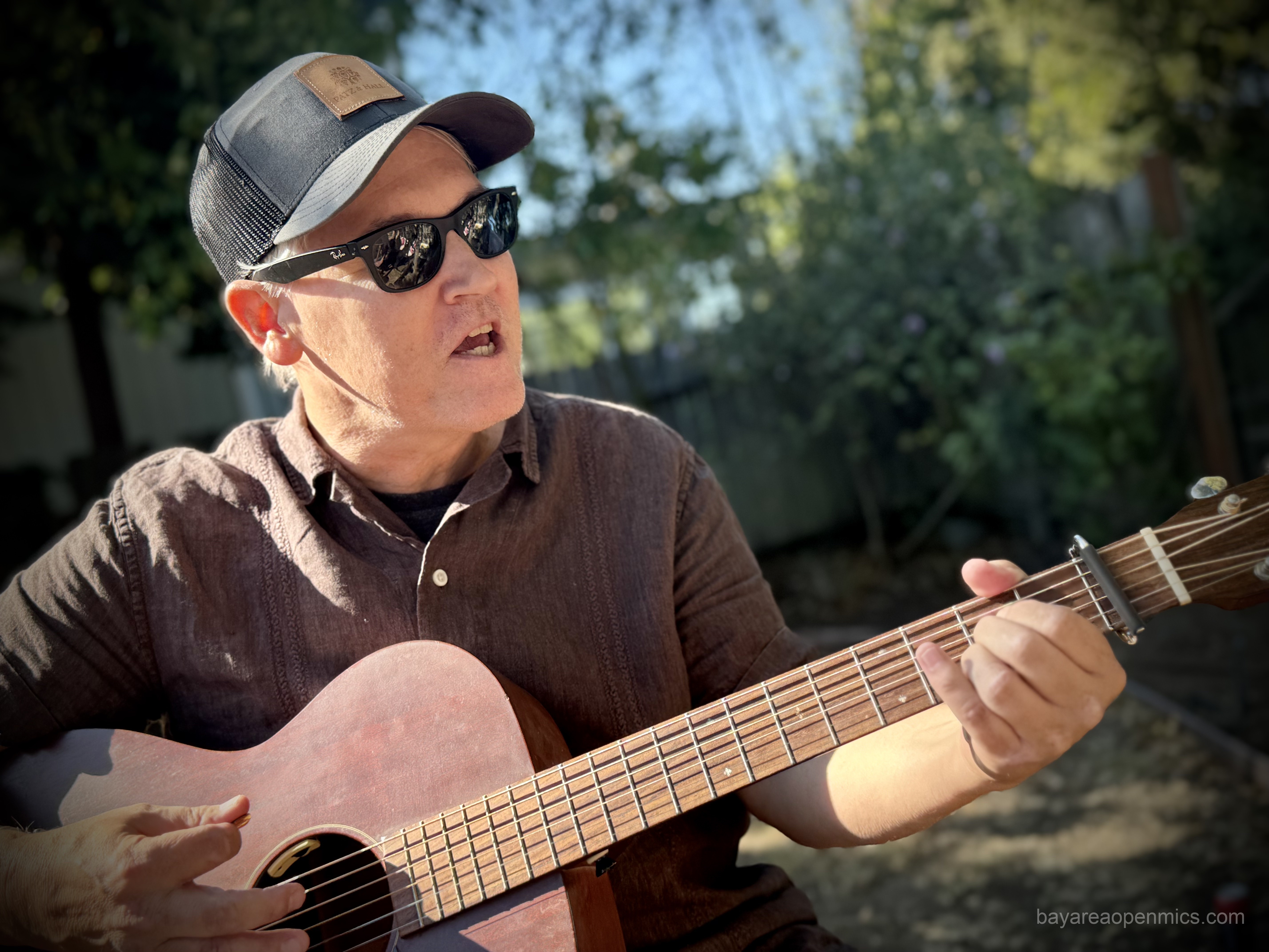 Drew Pearce performing live, host at Secret Song Club Open Mic Music Party in Occidental