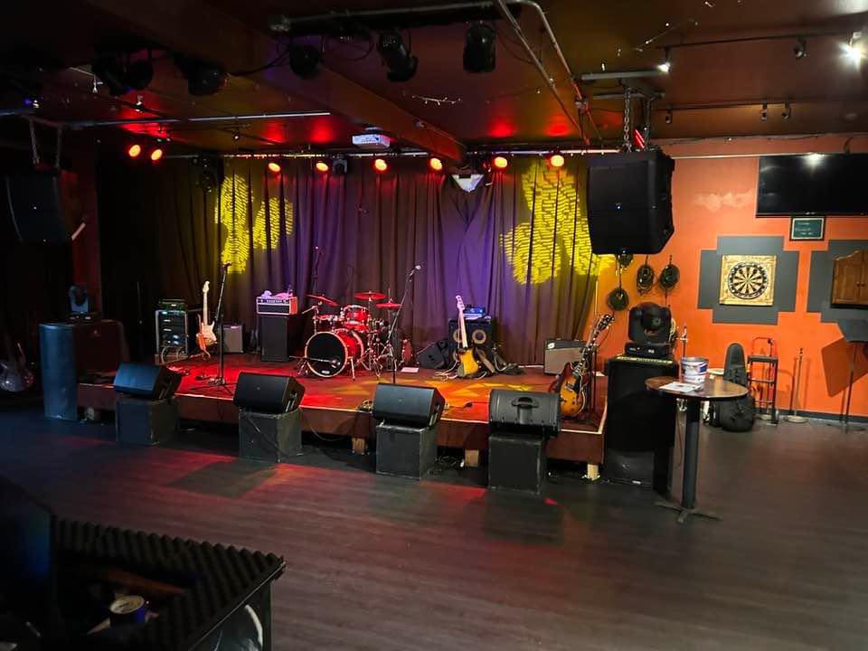 Photo of the performance area at music venue Longboard in Pacifica